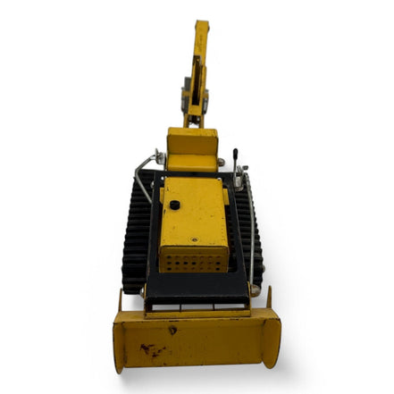 Front view of vintage Tonka Trencher toy with detailed metal construction