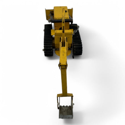 Rear view of Tonka Trencher toy highlighting backhoe and bulldozer features