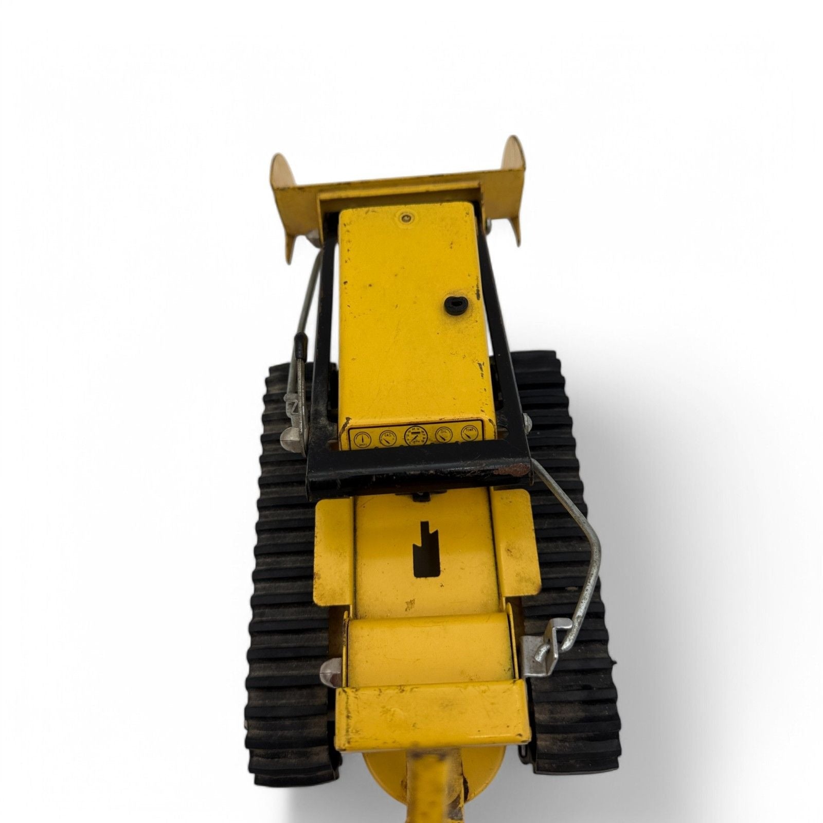 Close-up of Tonka Trencher toy's metal tracks and Tonka logo
