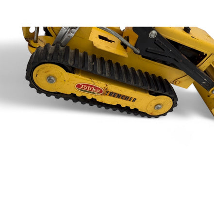 Vintage Tonka Trencher diecast metal excavator toy with yellow and black details