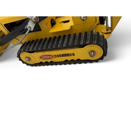 Vintage Tonka Trencher diecast metal excavator toy with yellow and black details