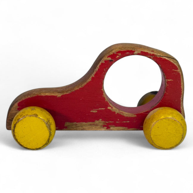 Vintage wooden push car with red and yellow globe wheels