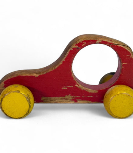 Vintage wooden push car with red and yellow globe wheels