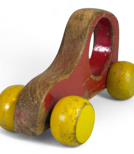 Handmade wooden car with red body and yellow wheels