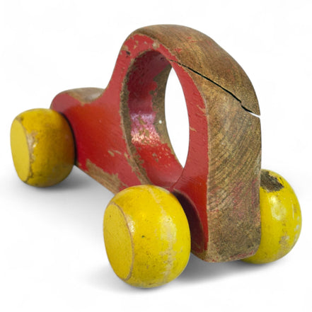 Vintage wooden push car with red and yellow globe wheels