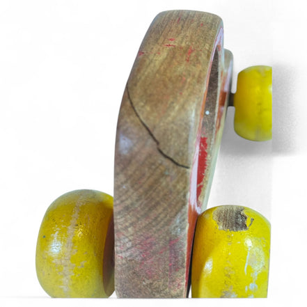 Vintage wooden push car with red and yellow globe wheels