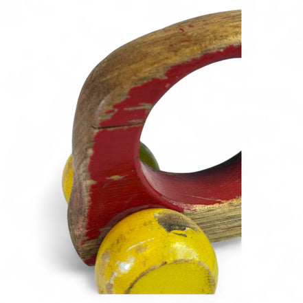 Vintage wooden push car with red and yellow globe wheels