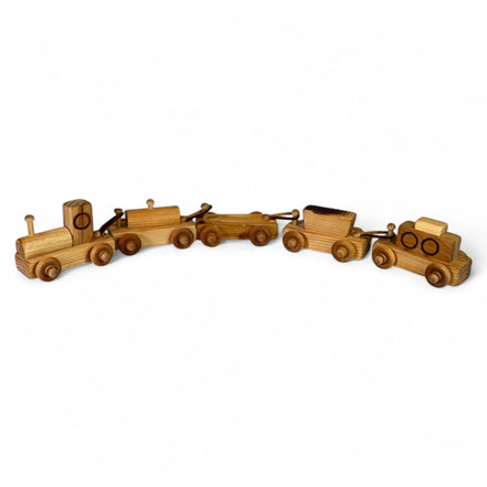 Vintage wooden toy train set with engine and four cars made from natural wood