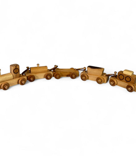 Vintage wooden toy train set with engine and four cars made from natural wood