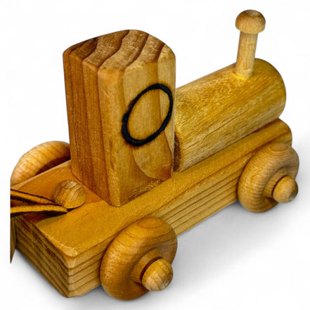 Wooden train engine with natural wood finish