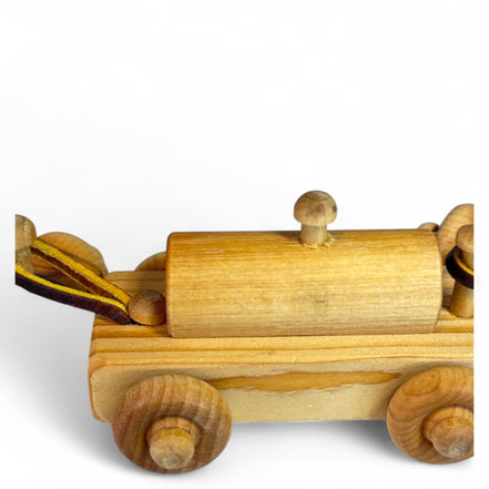 Close-up of the wooden train car's wheels and connectors