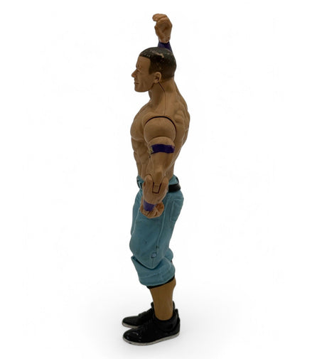 Side view of WWE John Cena action figure showing poseable arms
