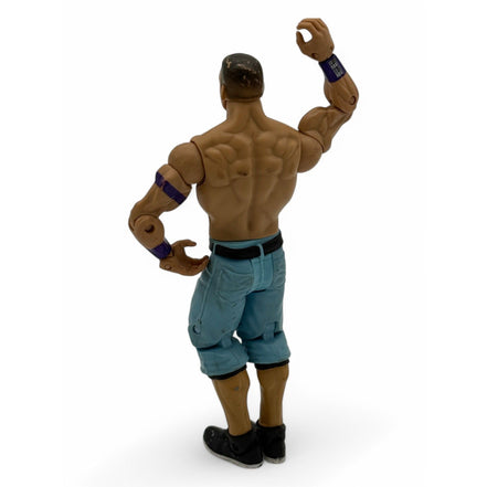 Back view of WWE John Cena action figure highlighting muscle details