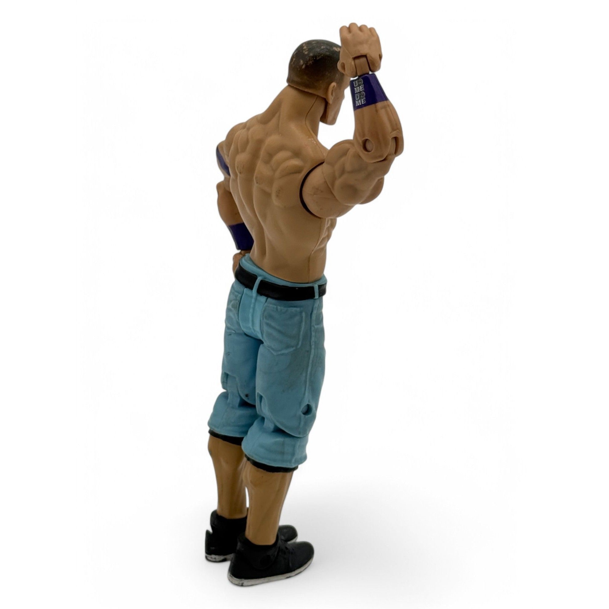 WWE John Cena action figure in blue pants and black shoes, front view