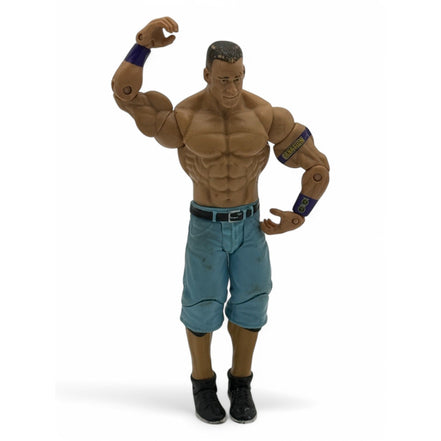 WWE John Cena action figure in blue pants and black shoes, front view