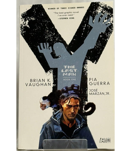 Cover of Y: The Last Man Book One by Brian K. Vaughan and Pia Guerra, featuring a stylized 'Y' and main character with a monkey.